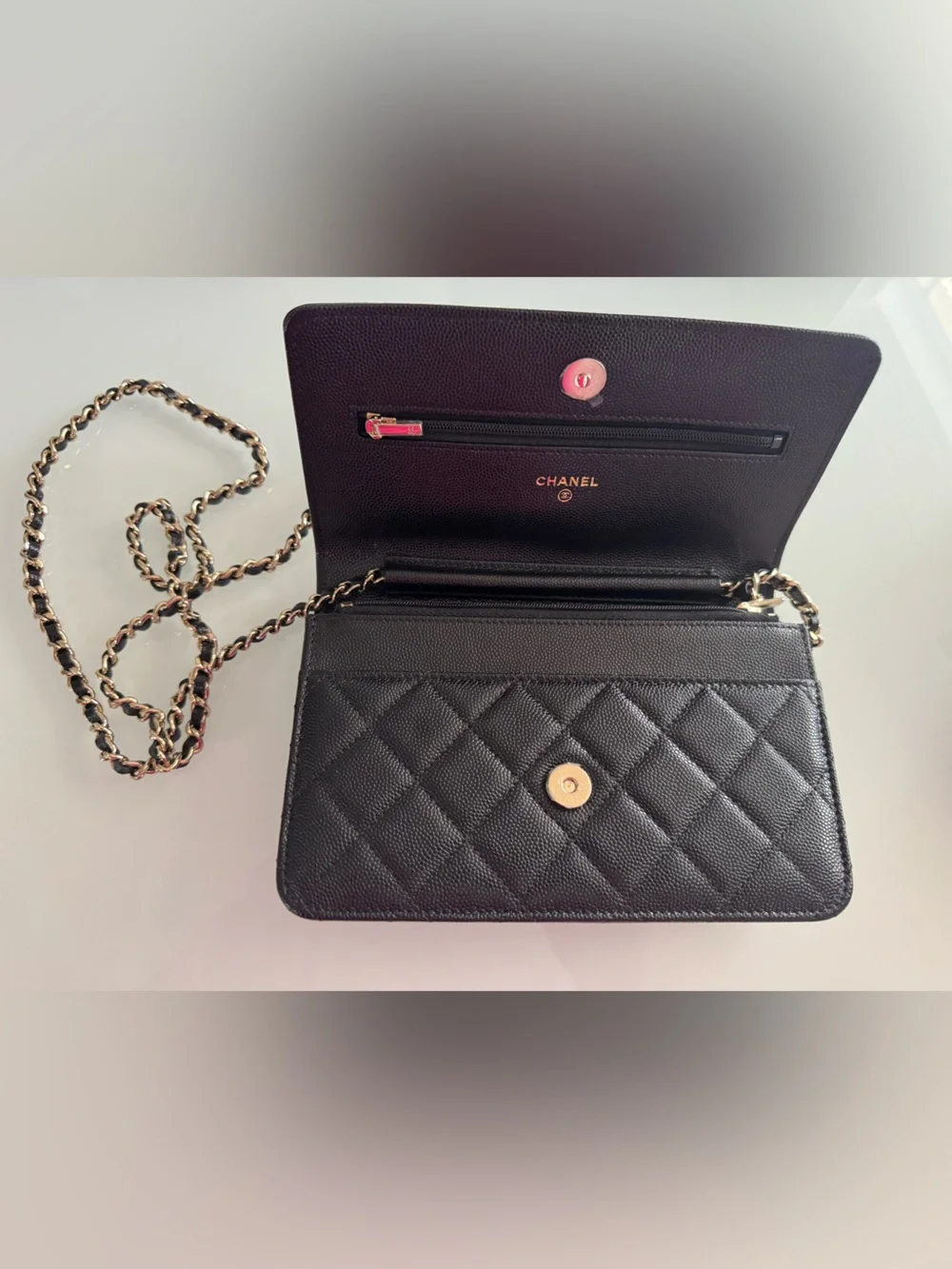 CHANEL WOC Black caviar leather with Gold Hardware and heart shaped crystal logo